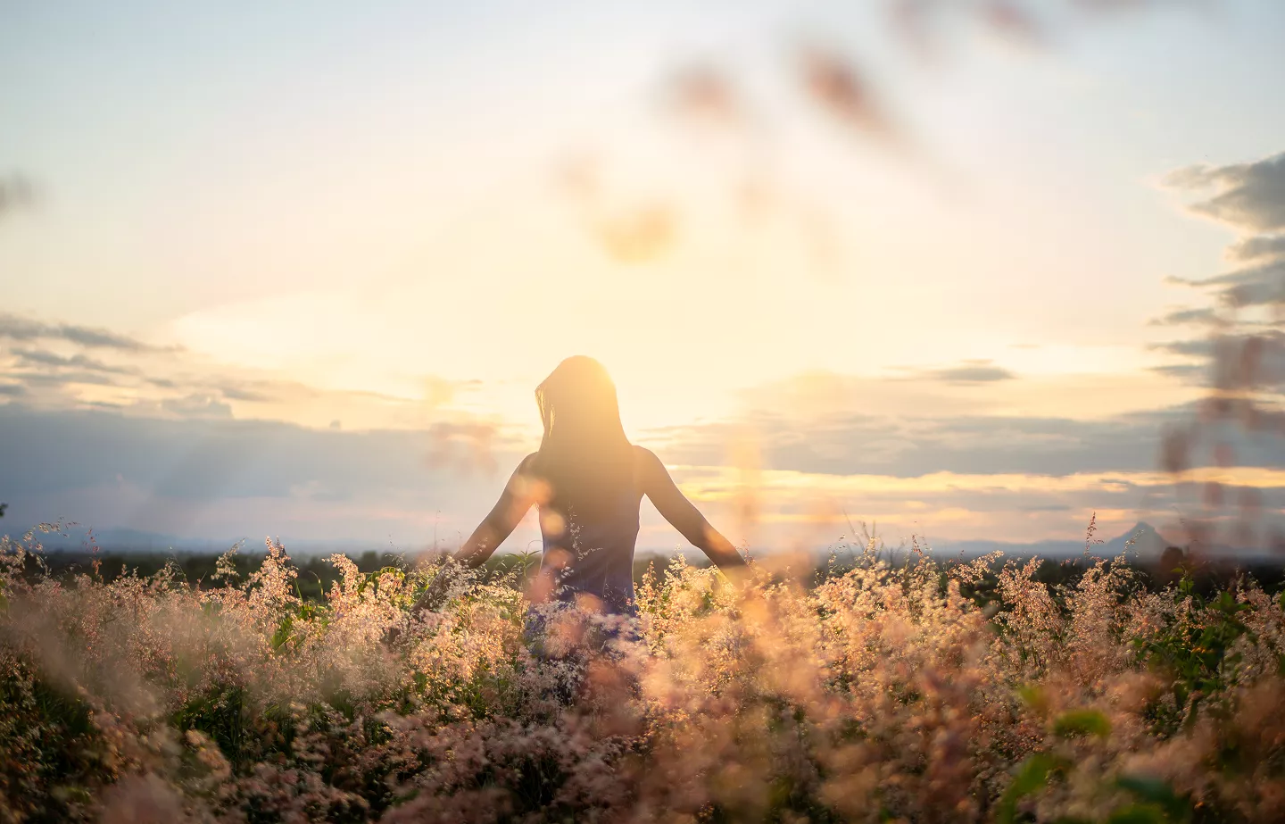 Muriel souriante sur un stand MH Coaching lors d’un événement